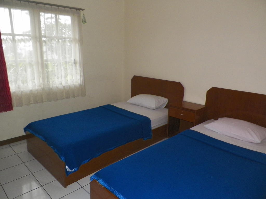 Hotel Puspa Sari Redpartner Чиатер Номер фото